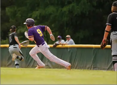  ?? Terrance Armstard/News-Times ?? On the move: Junction City's Joe Lowe runs towards second base during the Dragons' contest against Smackover on Thursday at Junction City. The Bucks downed the Dragons 7-3.