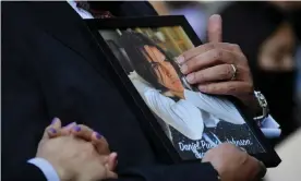  ?? Photograph: Patrick T Fallon/AFP/Getty Images ?? Jaime Puerta holds a portrait of his son Daniel Puerta-Johnson, who died in April 2020 at the age of 16 from a pill containing fentanyl, during a news conference in Los Angeles last year.