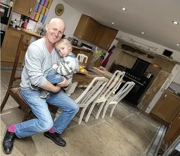  ??  ?? Simon Kelsey has opened up his Coltman Street home on Airbnb. Above, Simon with his son Elijah. Below, one of the bedrooms and Simon on the show Restoratio­n Project in 2012