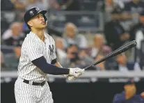  ?? KATHY WILLENS/THE ASSOCIATED PRESS ?? Yankees designated hitter Giancarlo Stanton watches his solo home run during Tuesday’s victory over the Boston Red Sox in New York.