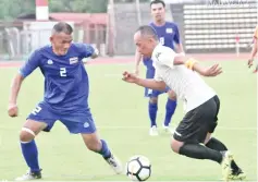  ??  ?? Action from the match between Thonburi (blue jersey) and Tuak (white jersey) in the Asean Four Corner Football Veteran Tournament at the Likas Stadium, yesterday.