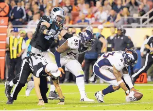  ?? JAE C. HONG/THE ASSOCIATED PRESS ?? T.J. Ward (43) of the Broncos recovers a fumble by Carolina quarterbac­k Cam Newton during the second half of Sunday’s Super Bowl. Denver won 24-10, recording seven sacks.
