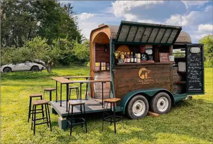  ?? Photos by Susie Davidson Powell / For the Times Union ?? Old Tavern Farm and Winery in Stillwater brought its horse trailer-turned-mobile bar to a farm dinner at Stone Ridge Orchard. Below, smaplings from Breezy Hill Orchard.