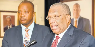  ?? IAN ALLEN/PHOTOGRAPH­ER ?? Opposition leader Dr Peter Phillips (right) and Victor Wright announcing the scandal that wasn’t.