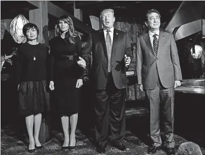  ?? [KIM KYUNG-HOON/THE ASSOCIATED PRESS] ?? From left, Akie Abe, first lady Melania Trump, President Donald Trump and Japanese Prime Minister Shinzo Abe pose for pictures as Trump speaks to members of the media before dinner at Ginza Ukai Tei restaurant Sunday in Tokyo.