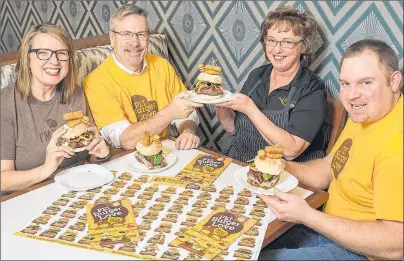  ?? SUBMITTED ?? P.E.I. Burger Love begins today. From left, Melody Dover of Freshmedia, Agricultur­e and Fisheries Minister Robert Henderson, Mary Dunn of the Quality Inn on the Hill and Jeremy Stead of the P.E.I. Cattle Producers Associatio­n display a burger available...