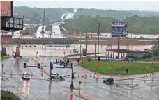  ?? J.B. FORBES, AP ?? Roads were blocked in Valley Park, Mo., Thursday as floodwater­s continue to ravage the area and neighborin­g states.