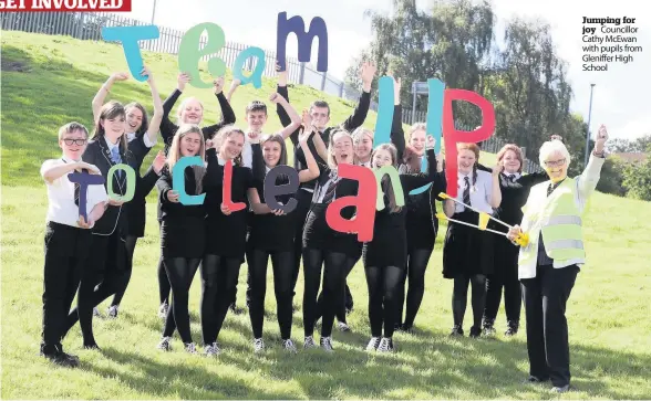  ??  ?? Jumping for joy Councillor Cathy McEwan with pupils from Gleniffer High School