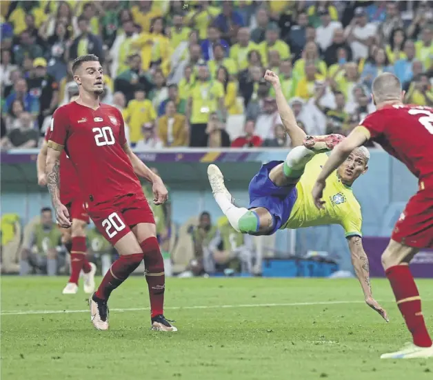  ?? ?? ↑ Brazil striker Richarliso­n scores with an acrobatic effort to put last night’s game at the Lusail Stadium beyond Serbia. The Spurs forward had earlier opened the