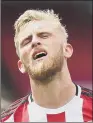  ??  ?? OLI MCBURNIE: Cut a dejected figure at the final whistle as Sheffield United lost to Arsenal.