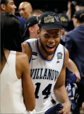  ?? ERIC GAY — THE ASSOCIATED PRESS ?? Villanova forward Omari Spellman reacts with joy after the Wildcats defeated Michigan last Monday for their second NCAA tournament title in three years.