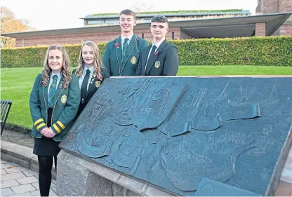  ?? Picture: Paul Smith. ?? Holly Bennett, Kate Maxton, Logan Gordon and Saul Mcgivney beside the new plaque outside Arbroath Abbey.