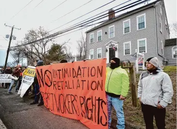  ?? Brian A. Pounds/Hearst Connecticu­t Media ?? Members of Unidad Latina en Acción protest outside MDF Painting Contractor on North Branford Road in Branford on Thursday. The company has been involved in workers comp and eviction cases with migrant workers.