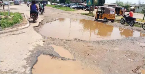  ?? PHOTO: AJULUCHUKW­U BROWN ?? Potholes on Kubwa road