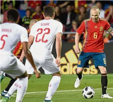  ?? — AFP ?? Making it count: Spain’s midfielder Andres Iniesta controllin­g the ball during the internatio­nal friendly match against Switzerlan­d on Sunday.
