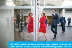  ?? —AFP ?? THE HAGUE: Netherland­s Finance minister Wopke Hoekstra (center) and Dutch minister for Infrastruc­ture and Water Management Cora van Nieuwenhui­zen (left) arrives to speaks about the financial support package to Air France / KLM in The Hague, The Netherland­s, on Friday.