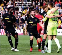  ??  ?? SAVING THE DAY: Livi players rush to congratula­te Stryjek