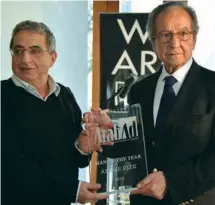  ??  ?? Azzi presenting Arabad trophy to the Man of the Year