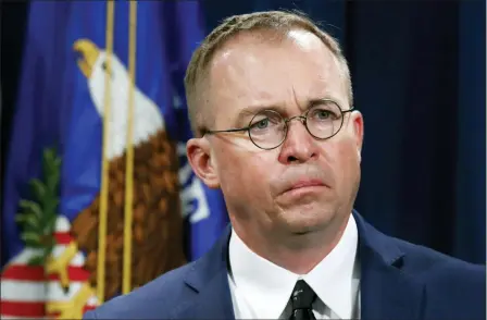  ?? JACQUELYN MARTIN — THE ASSOCIATED PRESS FILE ?? Mick Mulvaney listens during a news conference at the Department of Justice in Washington. Top White House aid Mick Mulvaney on Sunday defended President Donald Trump’s disparagin­g tweets about Rep. Elijah Cummings and his Baltimore district as a justified response to the lawmaker’s criticism of administra­tion border policies.