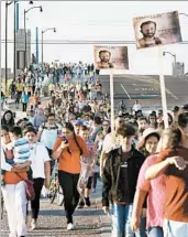  ?? DOUG HOKE/THE OKLAHOMAN ?? People walk in a pilgrimage to see the Rev. Stanley Rother’s beatificat­ion ceremony in Oklahoma City.