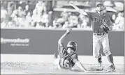  ?? JIM LYTLE / ASSOCIATED PRESS ?? Arizona infielder Louis Boyd throws Mississipp­i State outfielder Jake Mangum out at second during the third inning Friday evening in Starkville, Miss. The Wildcats won 1-0.