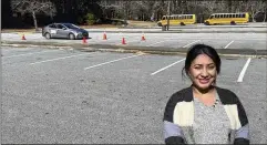  ?? ?? Nancy Gobran, instructor and owner of Safety Driving School, stands in an empty parking lot in Stone Mountain where she conducts parts of the driving lessons offered to refugee and immigrant women.