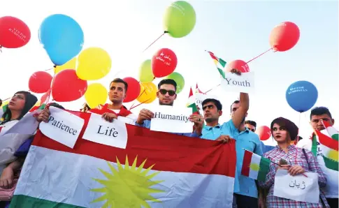  ??  ?? Iraqi Kurds take part in a demonstrat­ion at Irbil airport in the capital of Iraq’s autonomous northern Kurdish region after the central government ordered the indefinite halt to all foreign flights to and from Iraqi Kurdistan. (AFP)