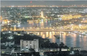  ??  ?? Night view of Phra Pok Klao Bridge and the Memorial Bridge over the Chao Phraya River.