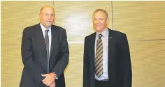  ??  ?? Kyle (left) is seen with Robinson. Kyle believes that the biggest challenge the state faces in continued implementa­tion of road maintenanc­e PBCs is managing the reallocati­on of operationa­l risks between contractor and JKR and the increase of...