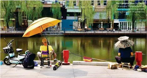  ?? ?? The Liangma River has been a popular hangout spot for Beijing residents, especially during the Covid-19 pandemic