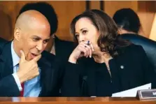  ?? AP PHOTO/J. SCOTT APPLEWHITE ?? Sen. Cory Booker, D-N.J., left, and Sen. Kamala Harris, D-Calif., confer Thursday before questionin­g Supreme Court nominee Brett Kavanaugh on the third day of his confirmati­on hearing with the Senate Judiciary Committee.