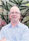  ??  ?? Macclesfie­ld Garden Festival organiser Jon Tilley with a monkey puzzle tree for the Jurassic garden