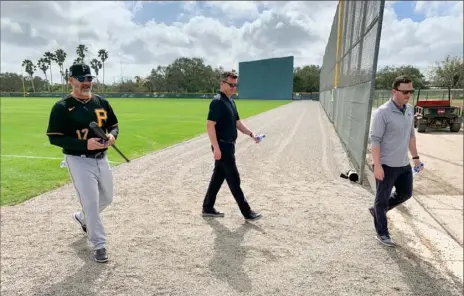  ?? Jason Mackey/Post-Gazette ?? Pirates manager Derek Shelton, left, and general manager Ben Cherington, middle, took a trip to meet up with some of Shelton’s “baseball family” from around the league, who sang Shelton’s praises.