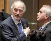  ?? — AP ?? Syrian ambassador to UN Bashar Ja’afari ( left), prepares to leave the Security Council chambers at the end of a meeting at the UN headquarte­rs on Tuesday.