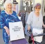  ??  ?? June Patterson and Pauline Keen with their clothes purchases