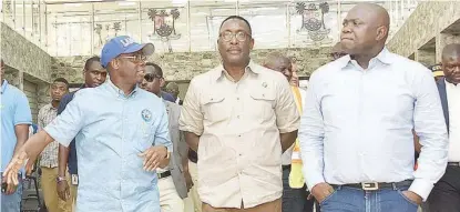  ??  ?? L-R: Abiodun Dabiri, general manager, Lagos State Metropolit­an Area Transport Authority (LAMATA); Ladi Lawanson, commission­er for transporta­tion, and Akinwunmi Ambode, governor, Lagos State, during the governor’s inspection of the Oyingbo Bus Terminal, in Lagos, yesterday.