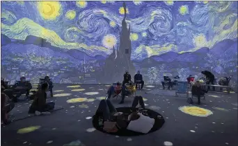  ?? ?? A projection of van Gogh’s Starry Night bathes viewers inside a Philadelph­ia-area theater.