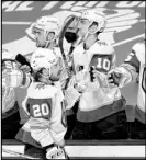  ?? Josie Lepe The Associated Press ?? Chandler Stephenson (20) gets the traditiona­l glove tap from teammates after his thirdperio­d goal against the Sharks.