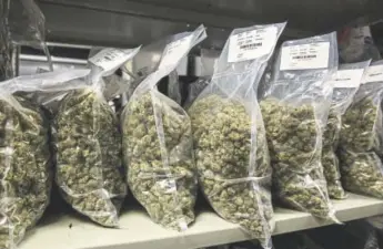  ?? Chris Roussakis, Bloomberg ?? Packages of marijuana are seen on shelf before shipment at the Canopy Growth Corp. facility in Smith Falls, Ontario, in December 2017.