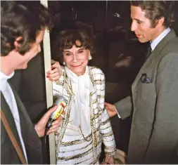  ??  ?? FAME. The designer with French principal dancer Jacques Chazot, right, during a fashion show in Paris in 1958.