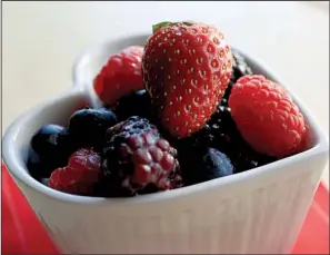  ?? Arkansas Democrat-Gazette/STATON BREIDENTHA­L ?? Berries can serve as a sweet, simple Valentine’s Day dessert.