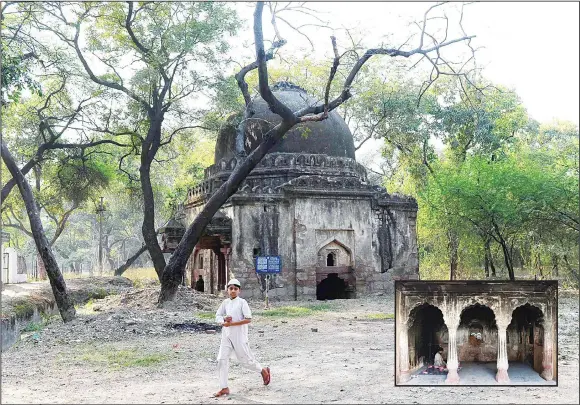  ??  ?? This photograph taken on Feb 25, 2016 shows a Muslim boy walking by a tomb at Mehrauli Archaeolog­ical Park in New Delhi. (Inset): In this photograph taken on Feb 24, 2016 an Indian man sits inside the tomb
of Atgah Khan in the Nizamuddin area of New...