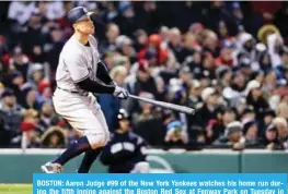  ??  ?? BOSTON: Aaron Judge #99 of the New York Yankees watches his home run during the fifth inning against the Boston Red Sox at Fenway Park on Tuesday in Boston, Massachuse­tts. — AFP