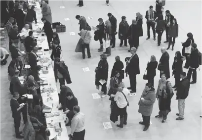  ?? FRANK GUNN/THE CANADIAN PRESS ?? Ontario Liberal Party leadership convention delegates register to vote at the leadership convention in Toronto on Friday, January 25, 2013.