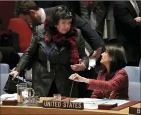  ?? JULIE JACOBSON — THE ASSOCIATED PRESS ?? Karen Pierce, left, British Ambassador to the United Nations, and Nikki Haley, United States Ambassador to the United Nations, talk during a Security Council meeting Tuesday at United Nations headquarte­rs.