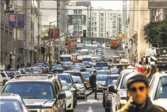  ?? Gabrielle Lurie / The Chronicle 2019 ?? Before the pandemic, Bay Area residents were concerned about the heavy traffic clogging streets and highways. Here, San Francisco’s Fremont Street is seen in March of last year.