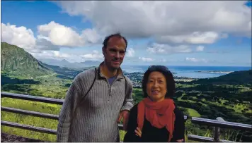  ?? COURTESY OF THE BISCHOF FAMILY ?? HAWAII: El Cerrito residents Otto and Kyoko Bischof went to Oahu in December for Kyoko’s Hawaii marathon and to take in the sights, including Nu’uanu Pali Lookout, pictured. “We enjoyed local shrimp, the best banana bread in the world — seriously! — and coconut water,” Kyoko says. “All the tropical food and drink blew us away.”
TRAVEL TIPS: “We bought a Groupon coupon for a day trip to go around the whole island with a guide, who was also our driver.” Some of the local food stands only take cash, not plastic, Kyoko notes, so “bring cash with you to explore real tropical food and drink.”