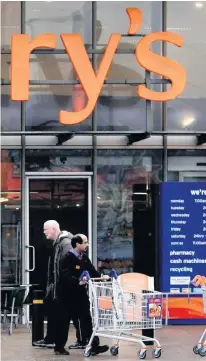  ??  ?? Shopping: Sainsbury’s store, and (right) some of the Spar items being sold by the supermarke­t giant