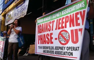  ?? Photo by Joven Peralta ?? NO TO PHASE OUT. A drivers’ associatio­n holds a rally opposing the proposed phase out of jeepney saying the plan is a scheme to monopolize public transport.