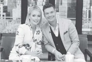  ?? DISNEY/ABC VIA THE ASSOCIATED PRESS ?? Kelly Ripa and Ryan Seacrest pose for a photo at “Live” on Monday in New York. Seacrest was named co-host of the morning chat show, ending a yearlong search to replace Michael Strahan.